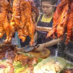 Chinese Street Food in Bangkok, Thailand. Jumbo Lobster, Crispy Pork, Duck, Prawn. Yaowarat Road