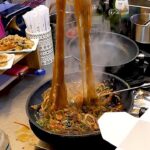 Glass noodles stir-fried with vegetables (Japchae) – Korean street food