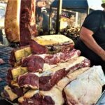 Large Grills with Huge Steaks Grilled Texas-Style. Yummy Street Food at Biker Fest in Lignano, Italy