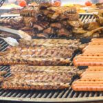 Italy Street Food. Juicy Ribs, Stuffed Sandwiches, Pork Knuckles and more Roasted Meat