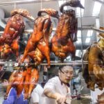 The Chinese Roasted Duck Tasted in Mong Kok, Hong Kong. Chinese Street Food.